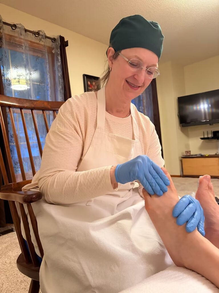 Nurse providing specialized foot care for a chronic condition